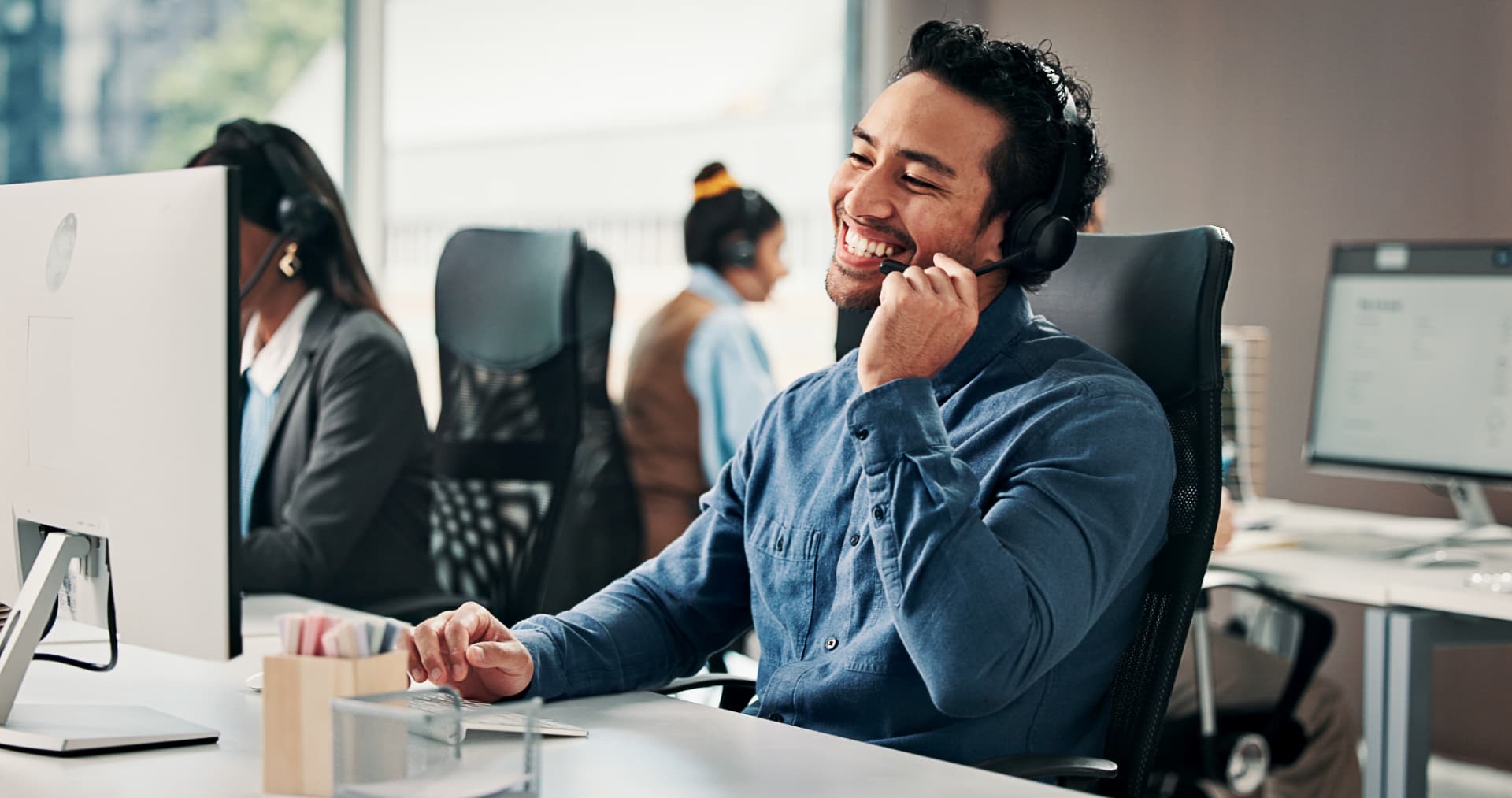 A customer support specialist helping a customer by phone