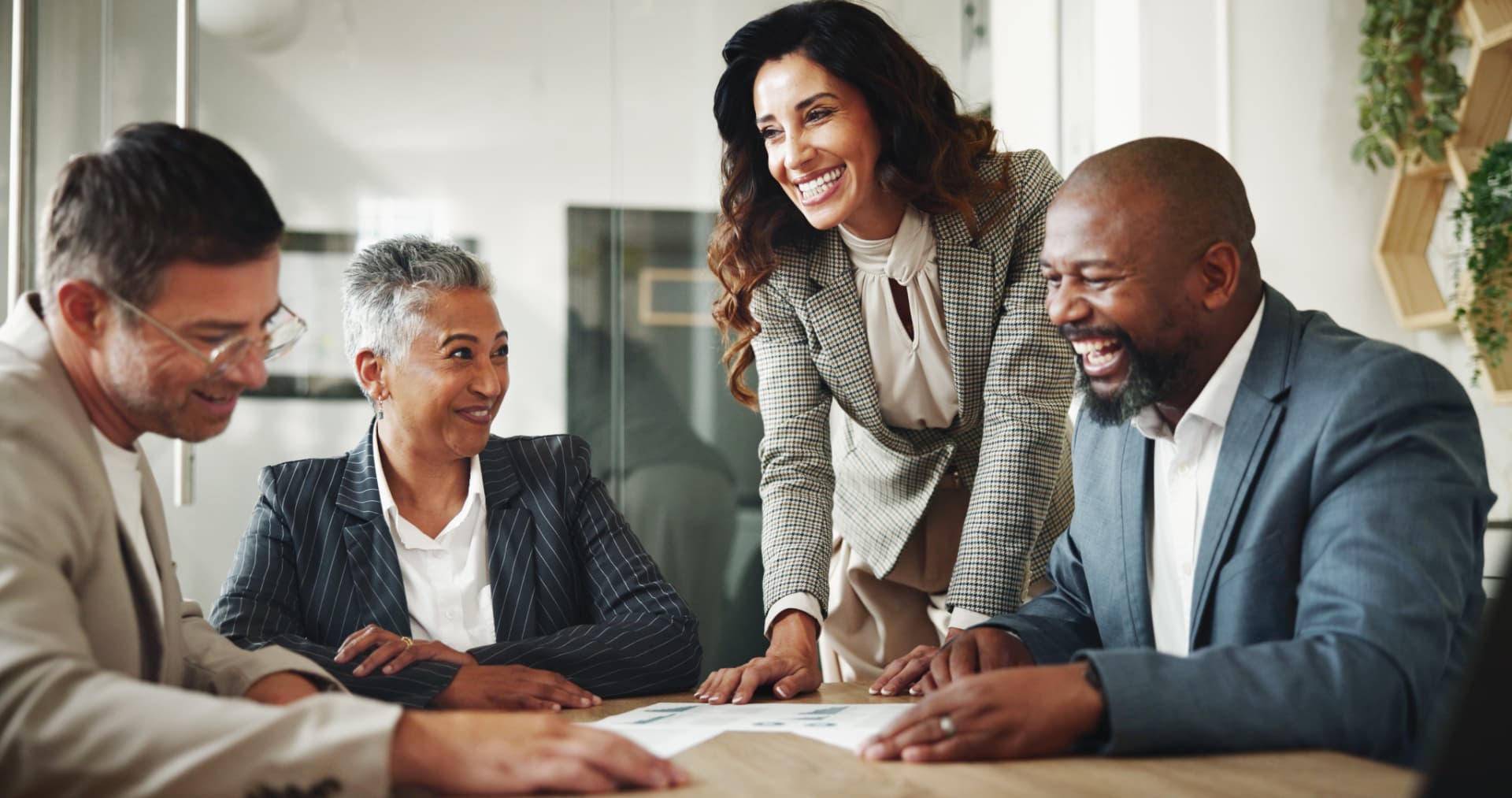 Professionals reviewing work together around a table